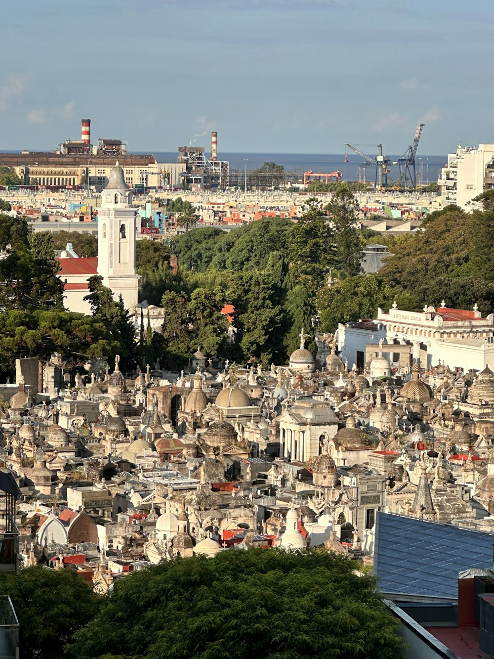 a view of a city with a clock tower in the middle