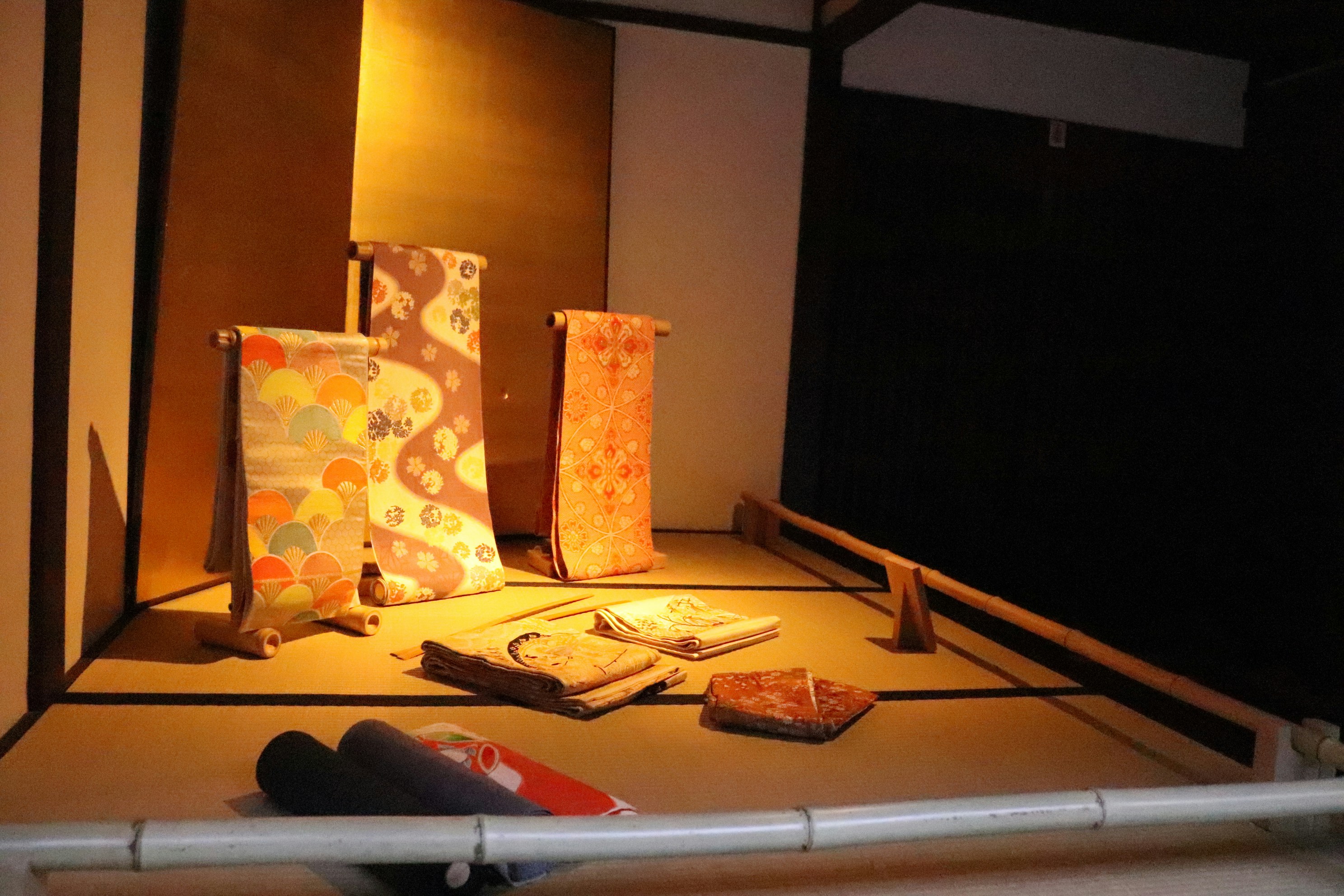 A cluttered room with various items scattered across the floor