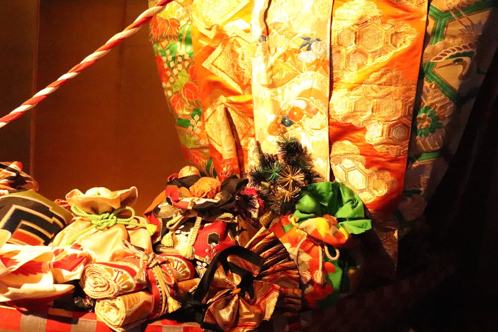 a pile of wrapped presents sitting on top of a table