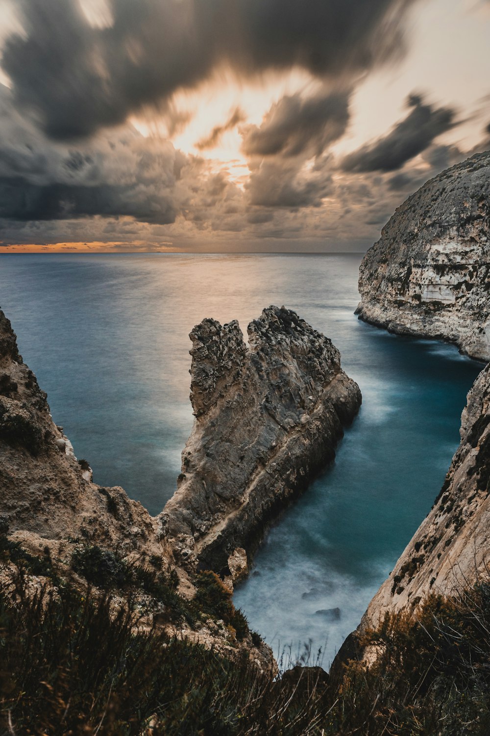 a large body of water surrounded by rocks