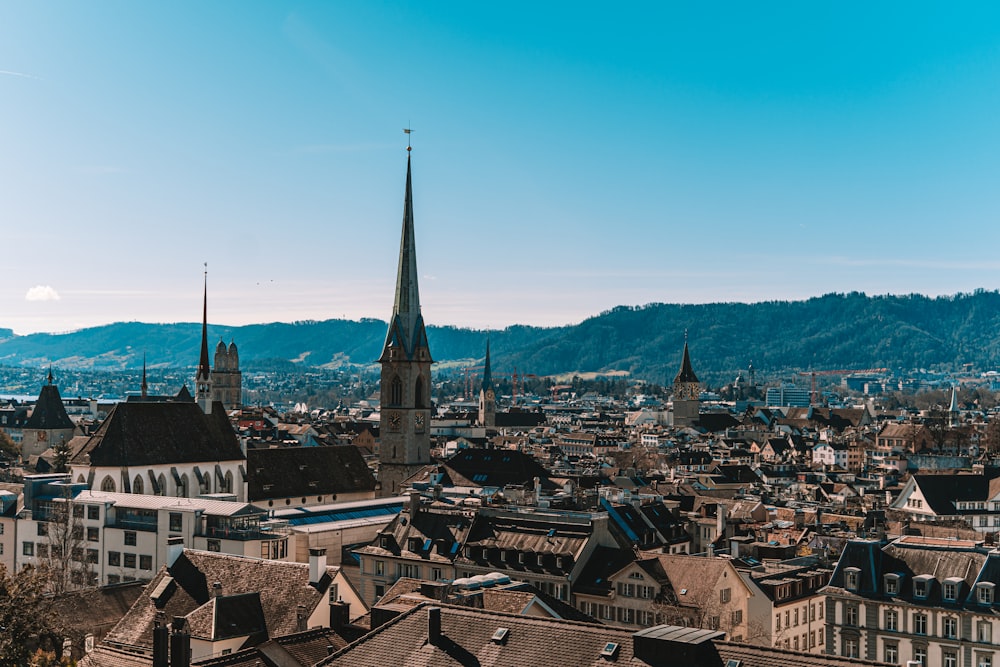 a view of a city with mountains in the background