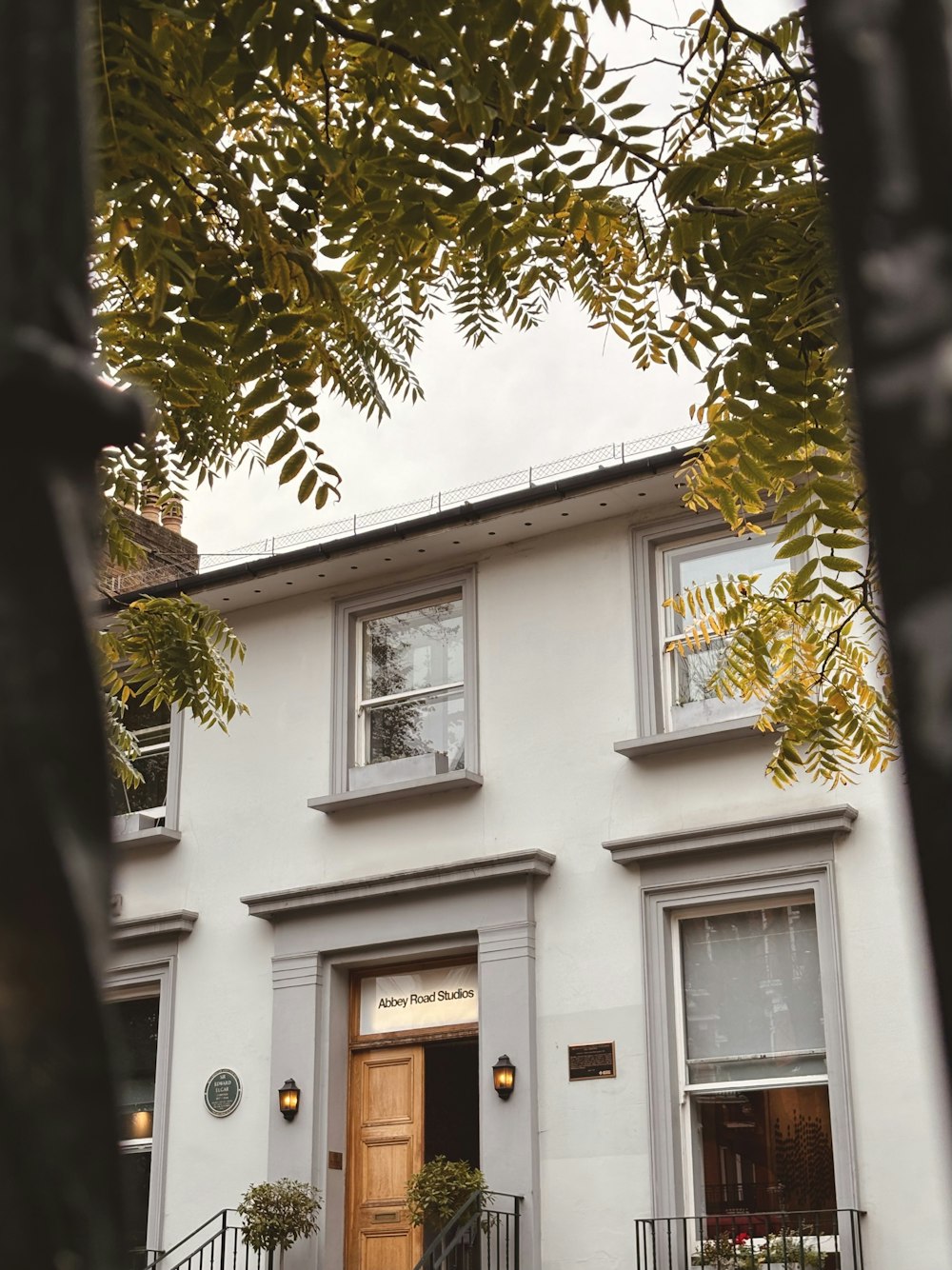 a white house with a brown door and window