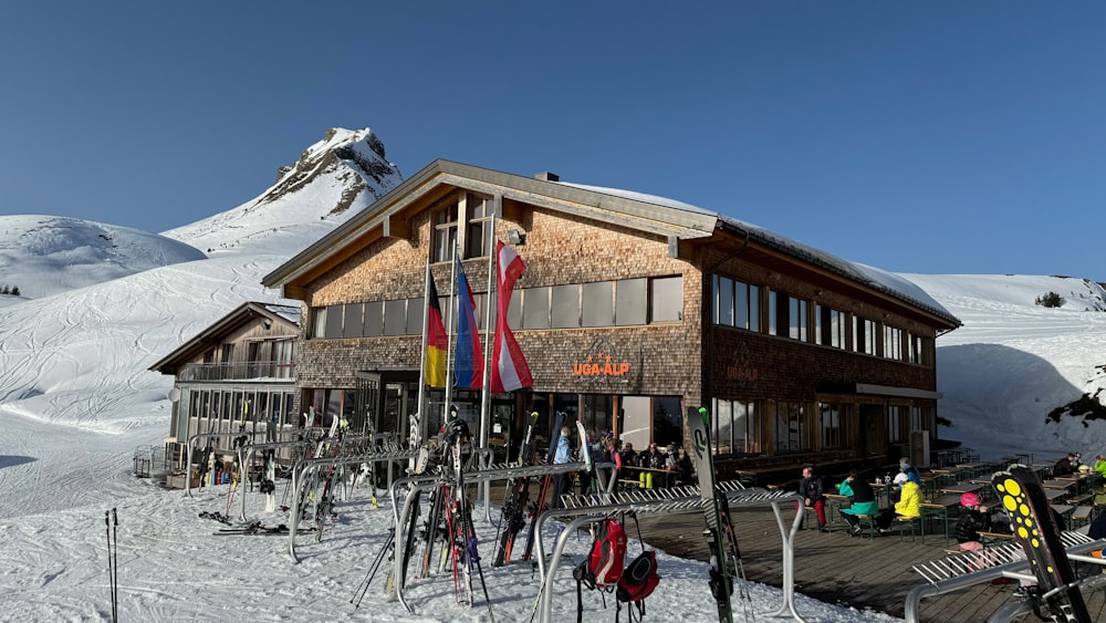 a group of people standing outside of a ski lodge