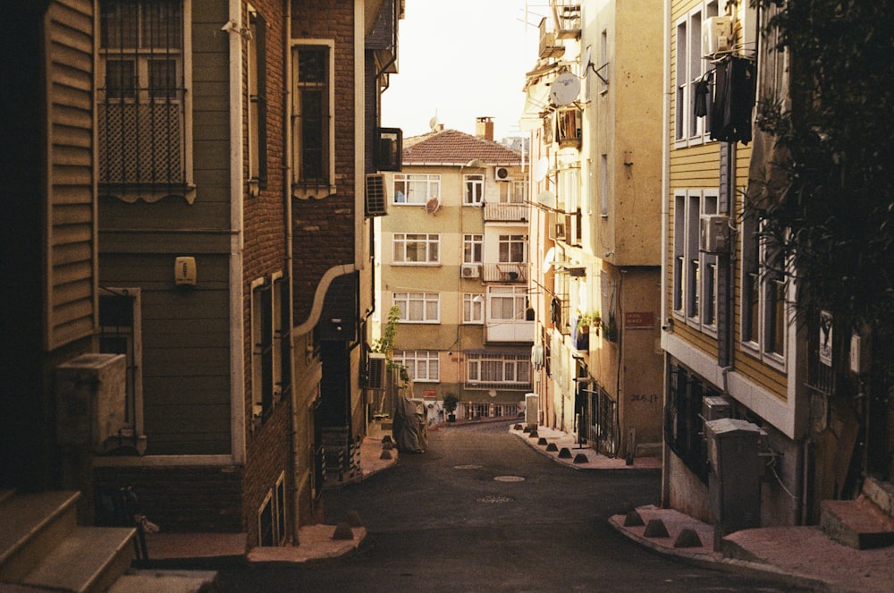 a narrow city street with buildings on both sides