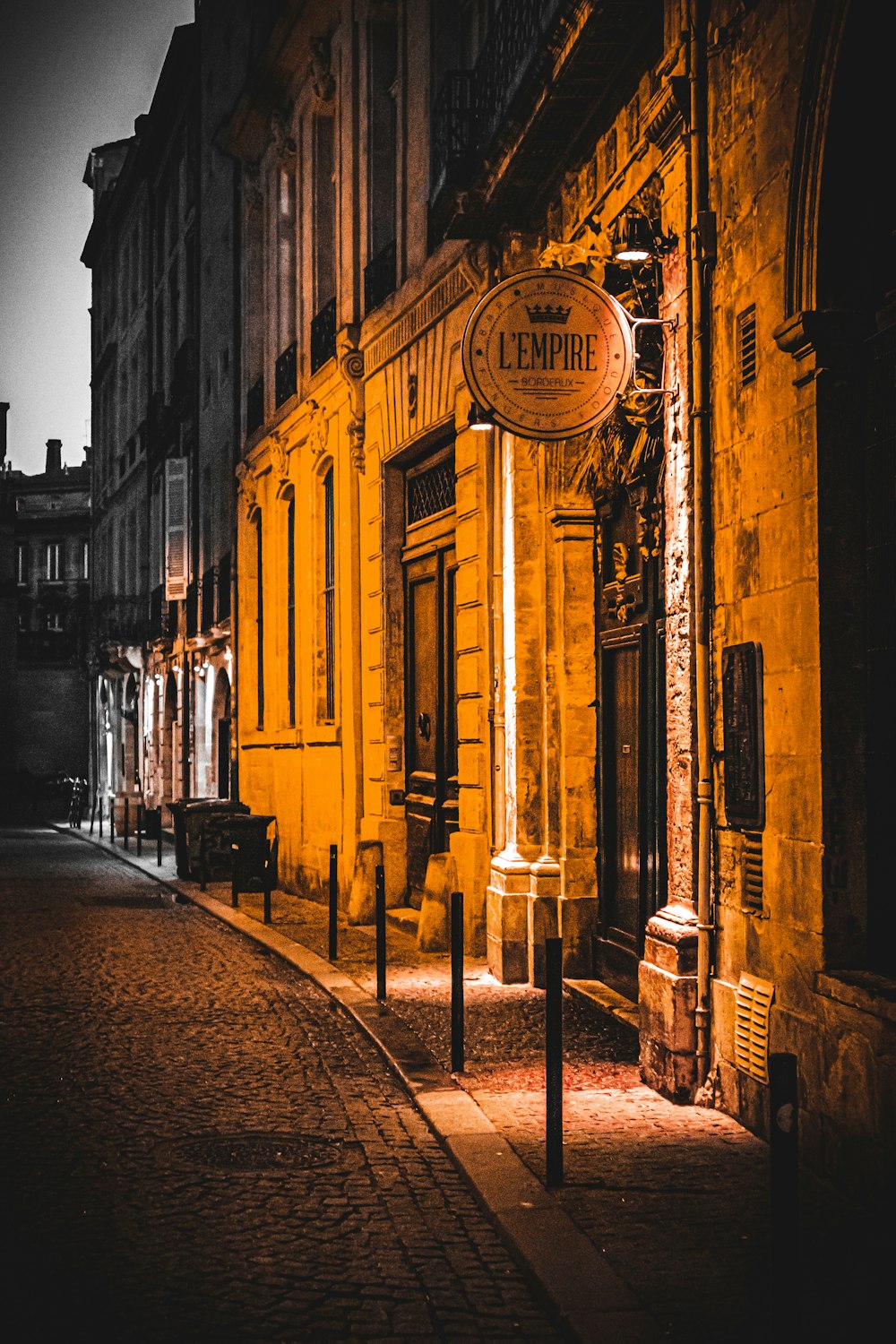 a yellow building with a sign on the side of it