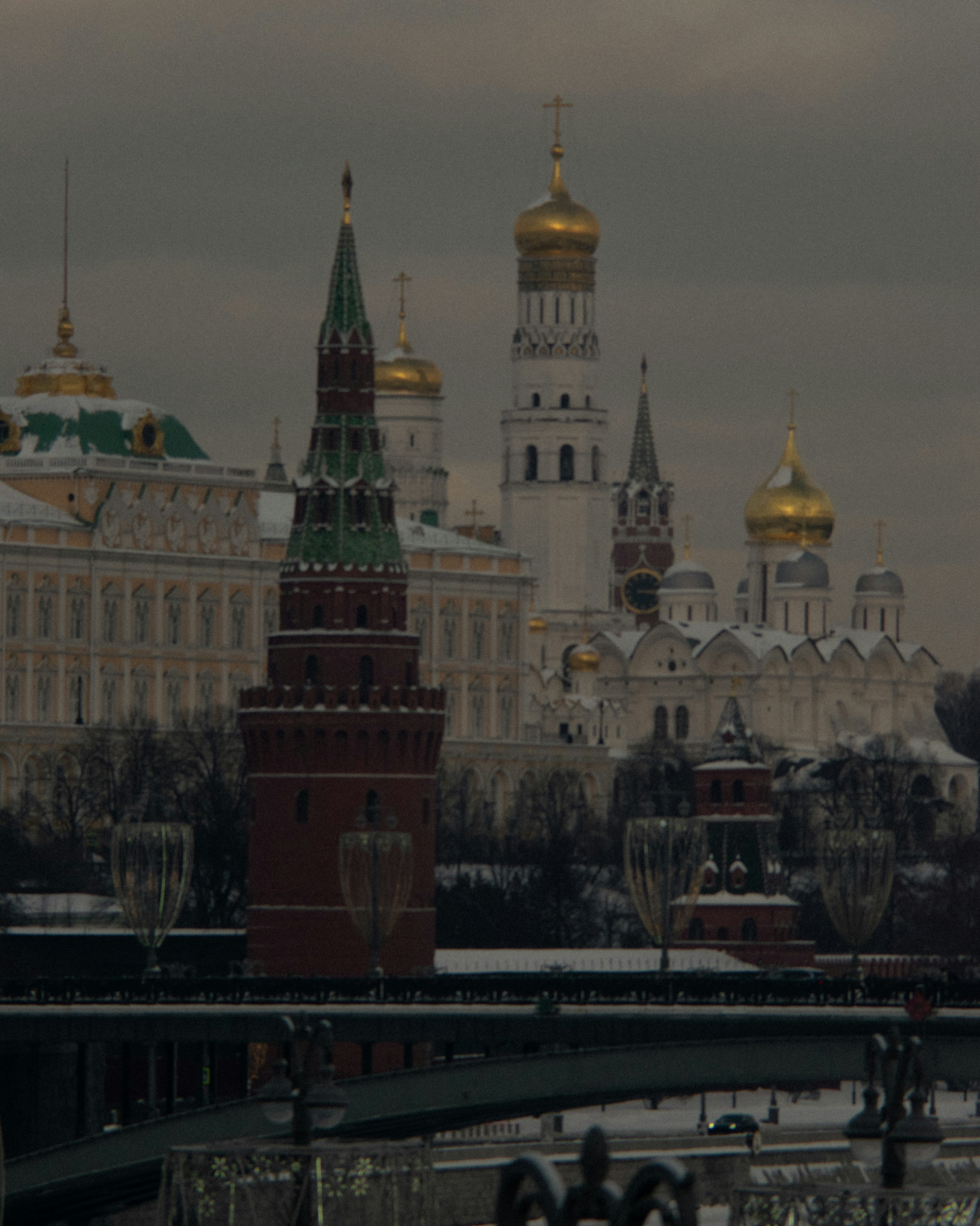 a clock tower in front of a large building