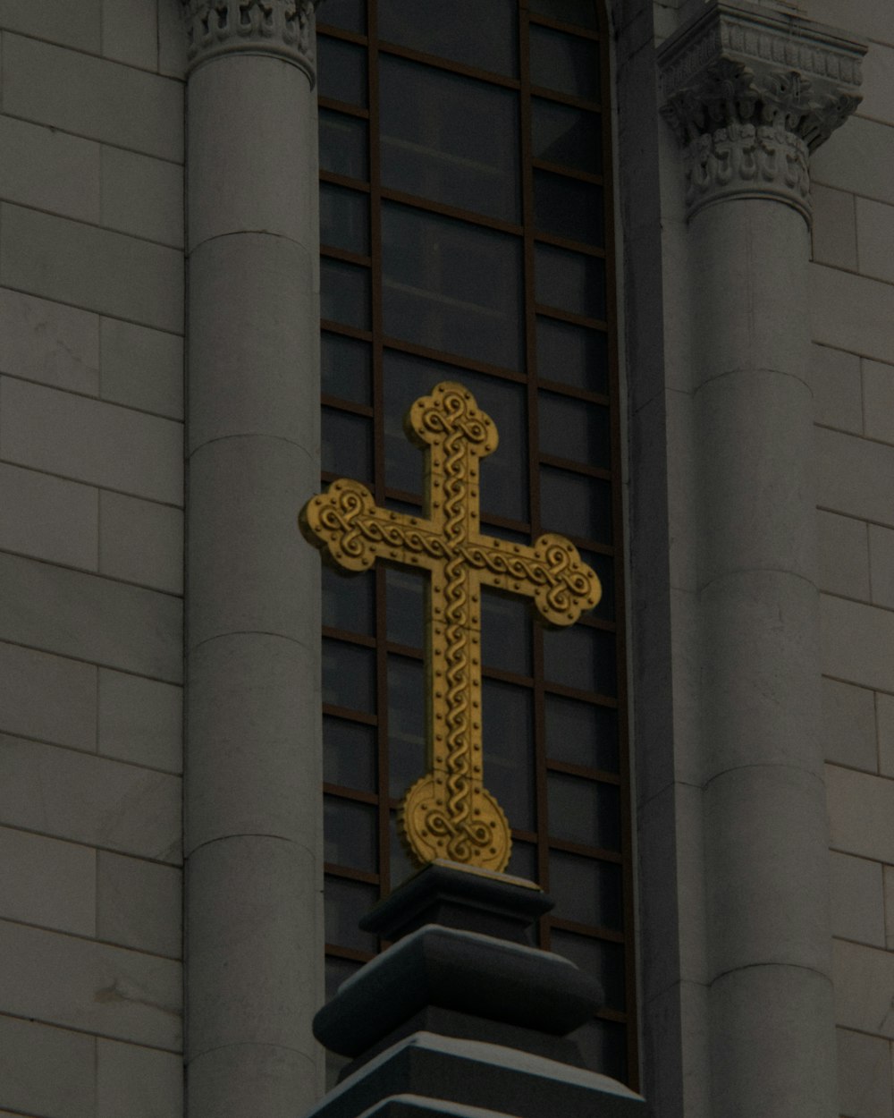 a cross on the side of a building