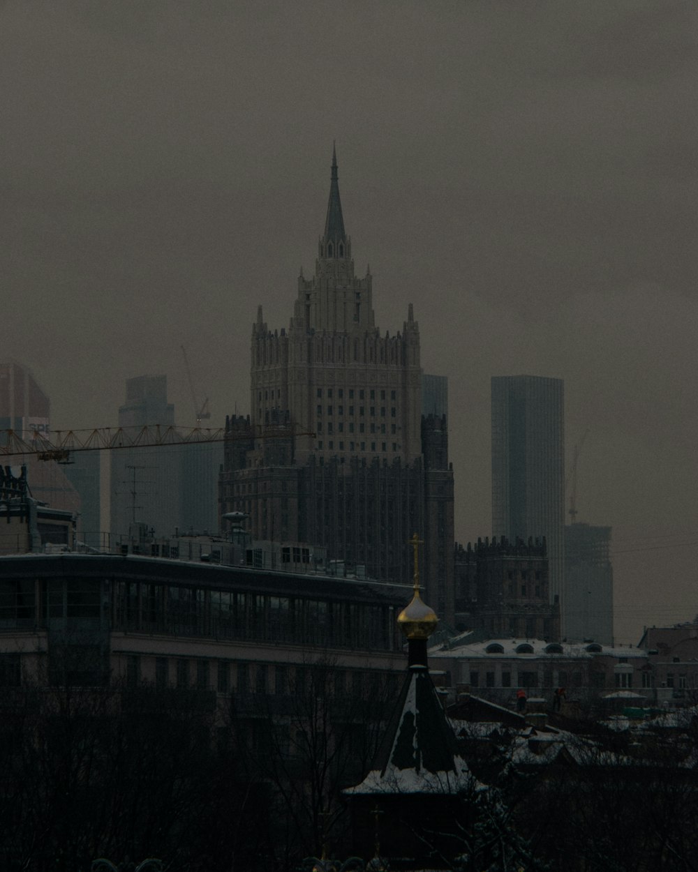 a city skyline with a clock tower in the foreground