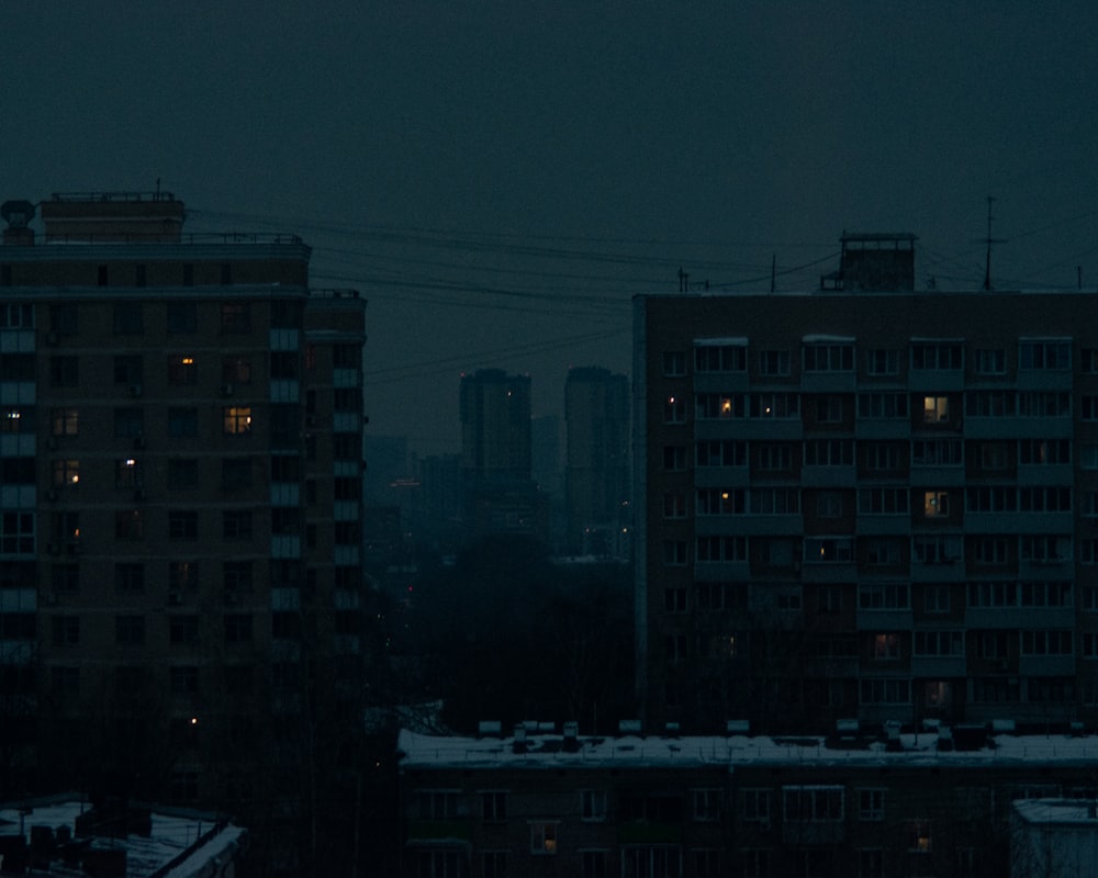 a view of a city at night from a rooftop