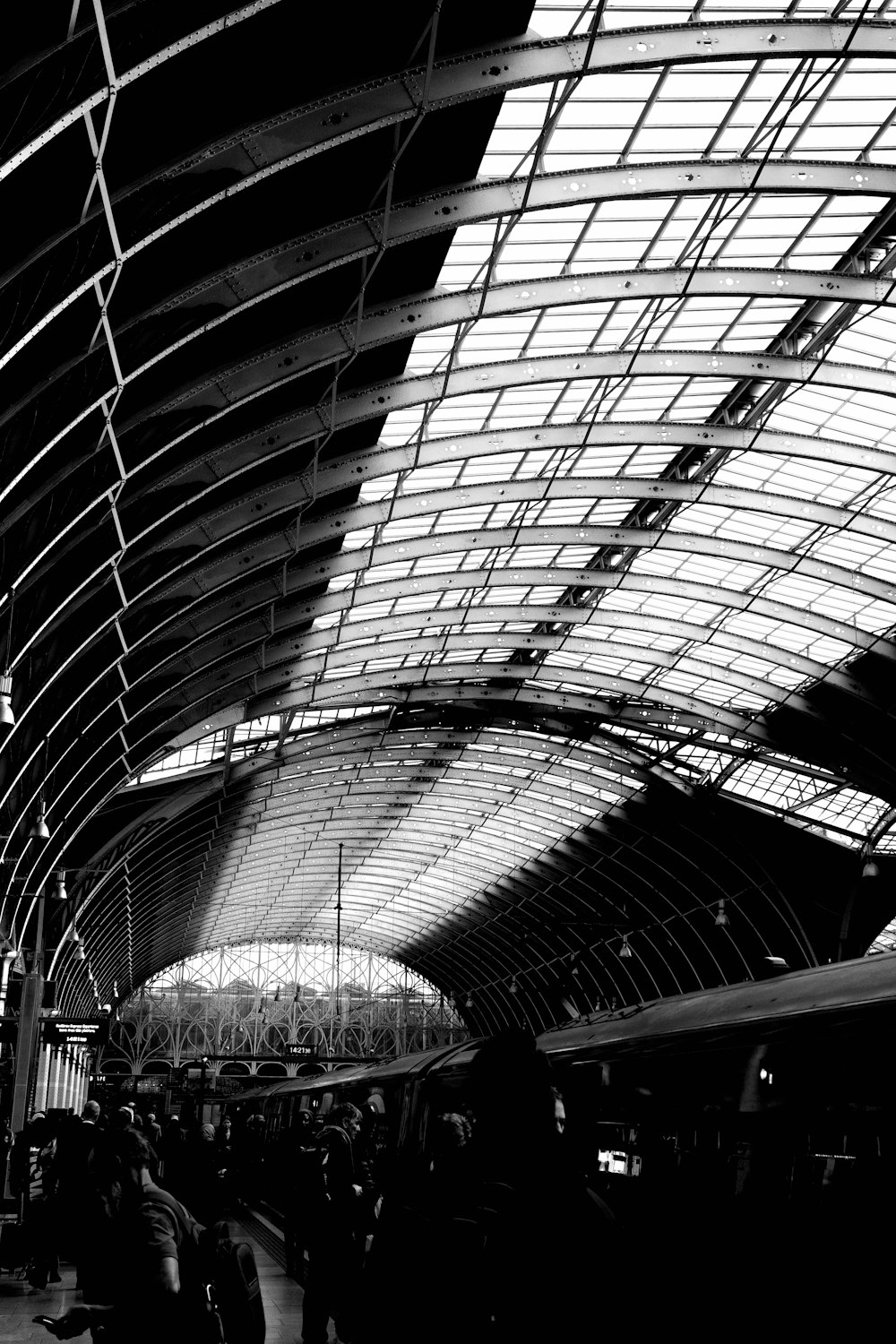 a black and white photo of a train station