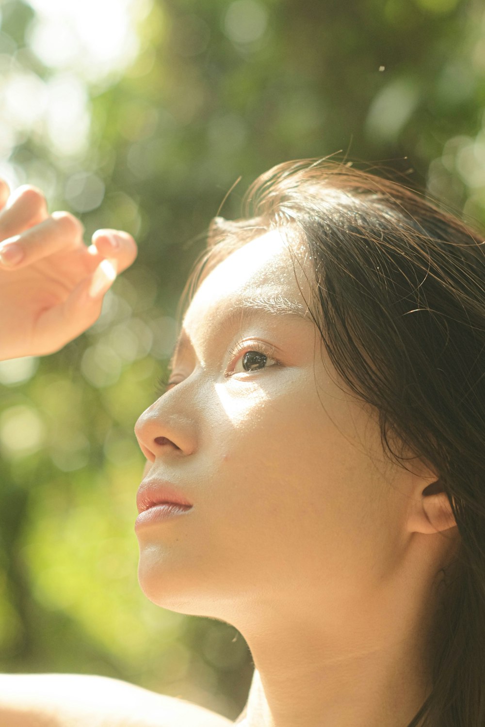 a woman is holding a cell phone up to her ear