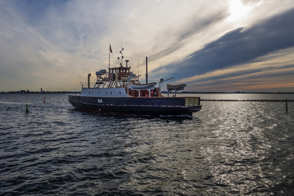 a large boat floating on top of a body of water