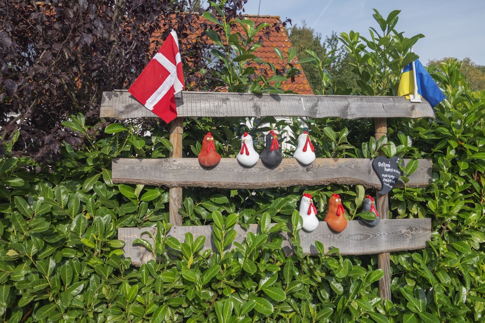 a wooden bench with a bunch of shoes on it