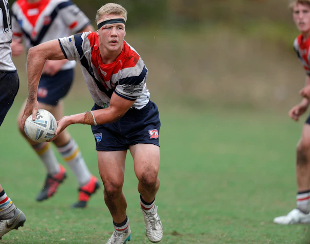 a group of young men playing a game of rugby