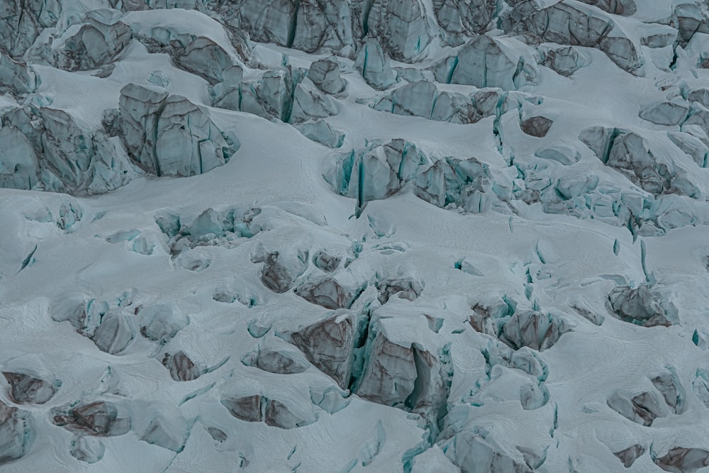 a man riding skis down a snow covered slope