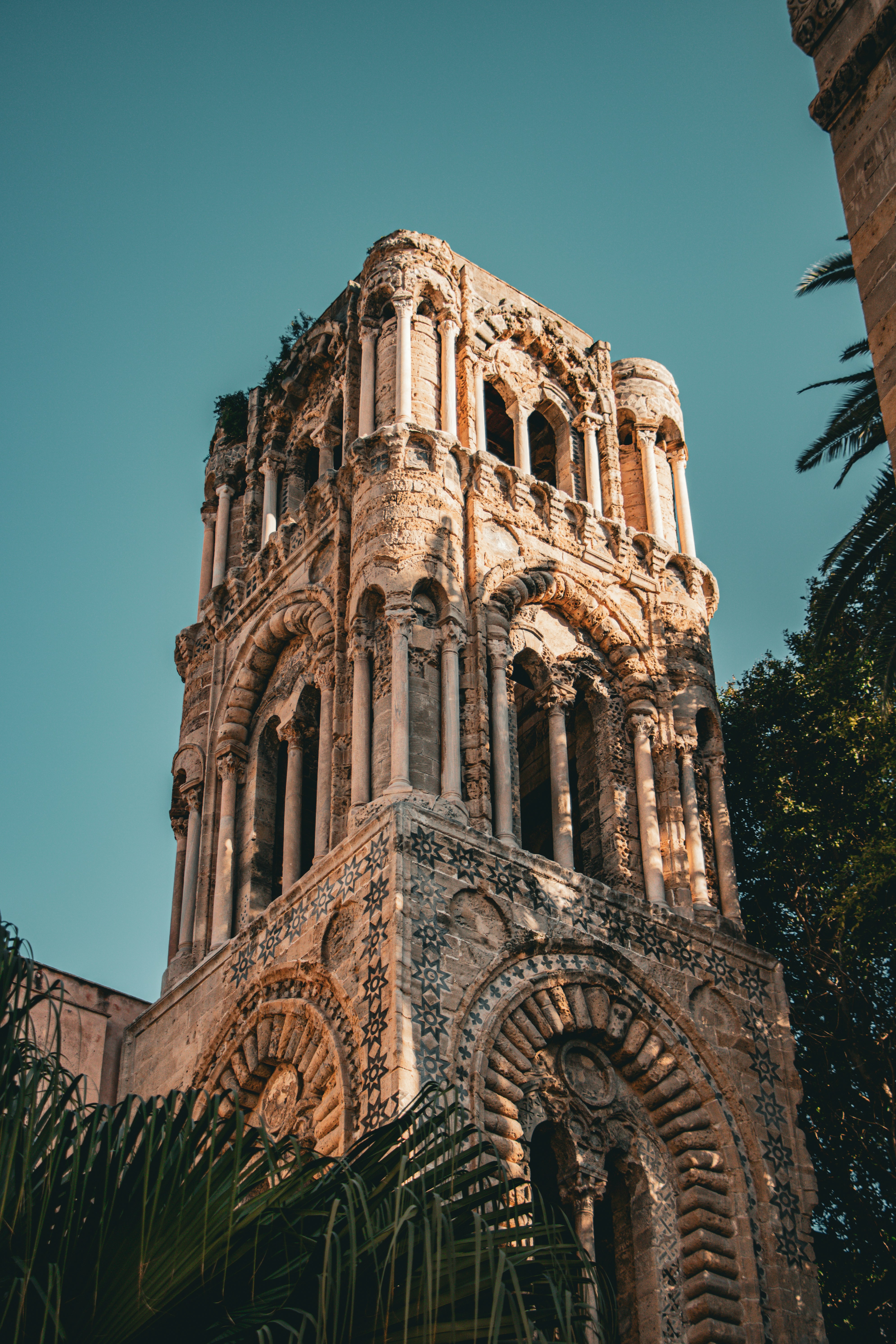 a tall tower with a clock on the top of it