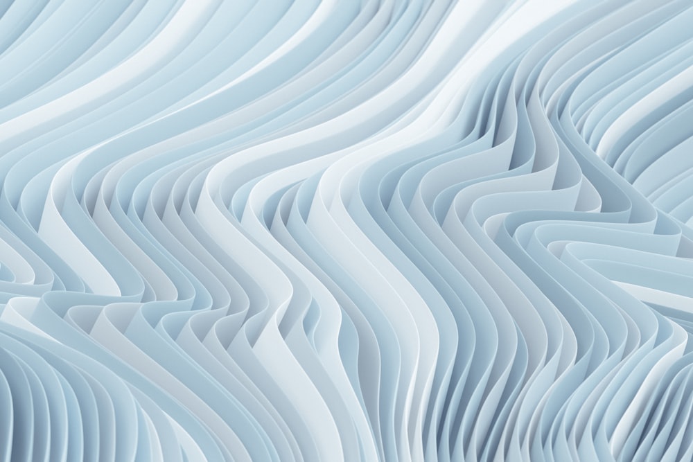a blue and white abstract background with wavy lines
