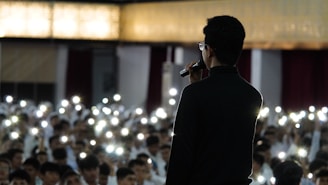 a man standing in front of a crowd of people