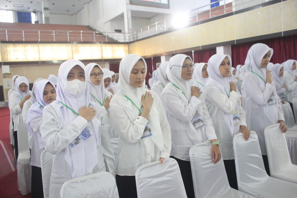 a group of women standing next to each other