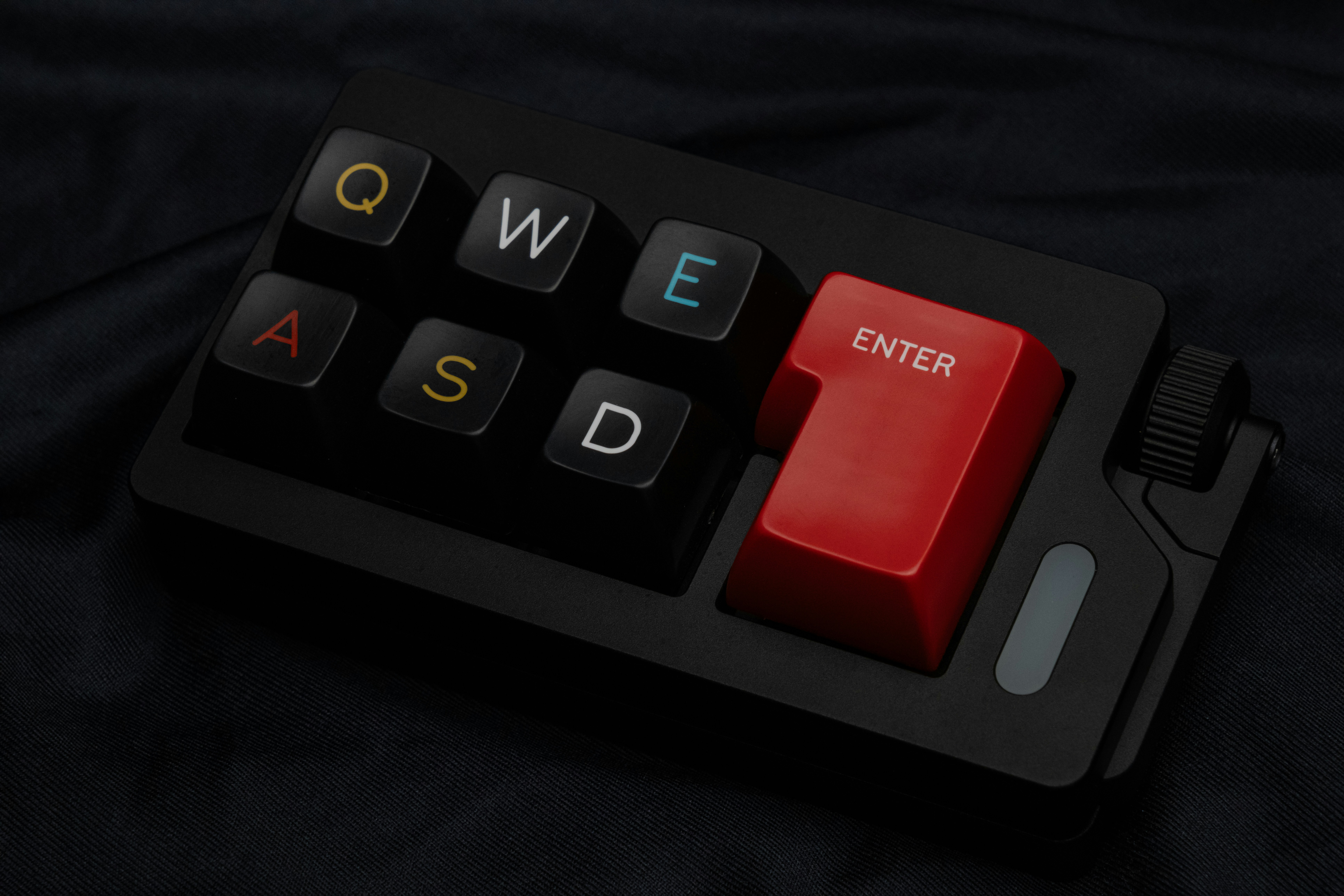 a black and red computer keyboard with the word sw e d on it