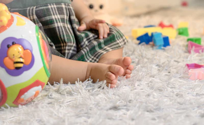 a baby is playing with toys on the floor