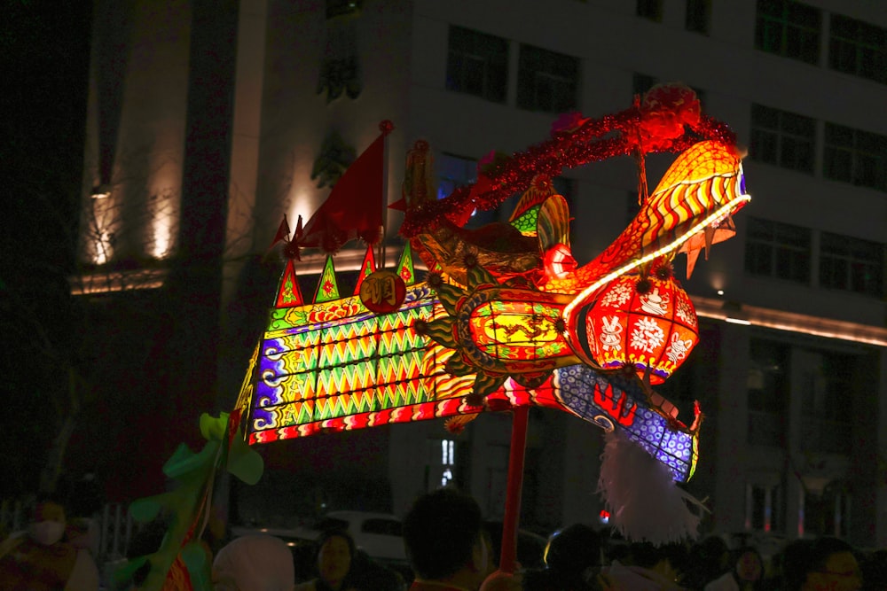 a dragon lantern is lit up at night