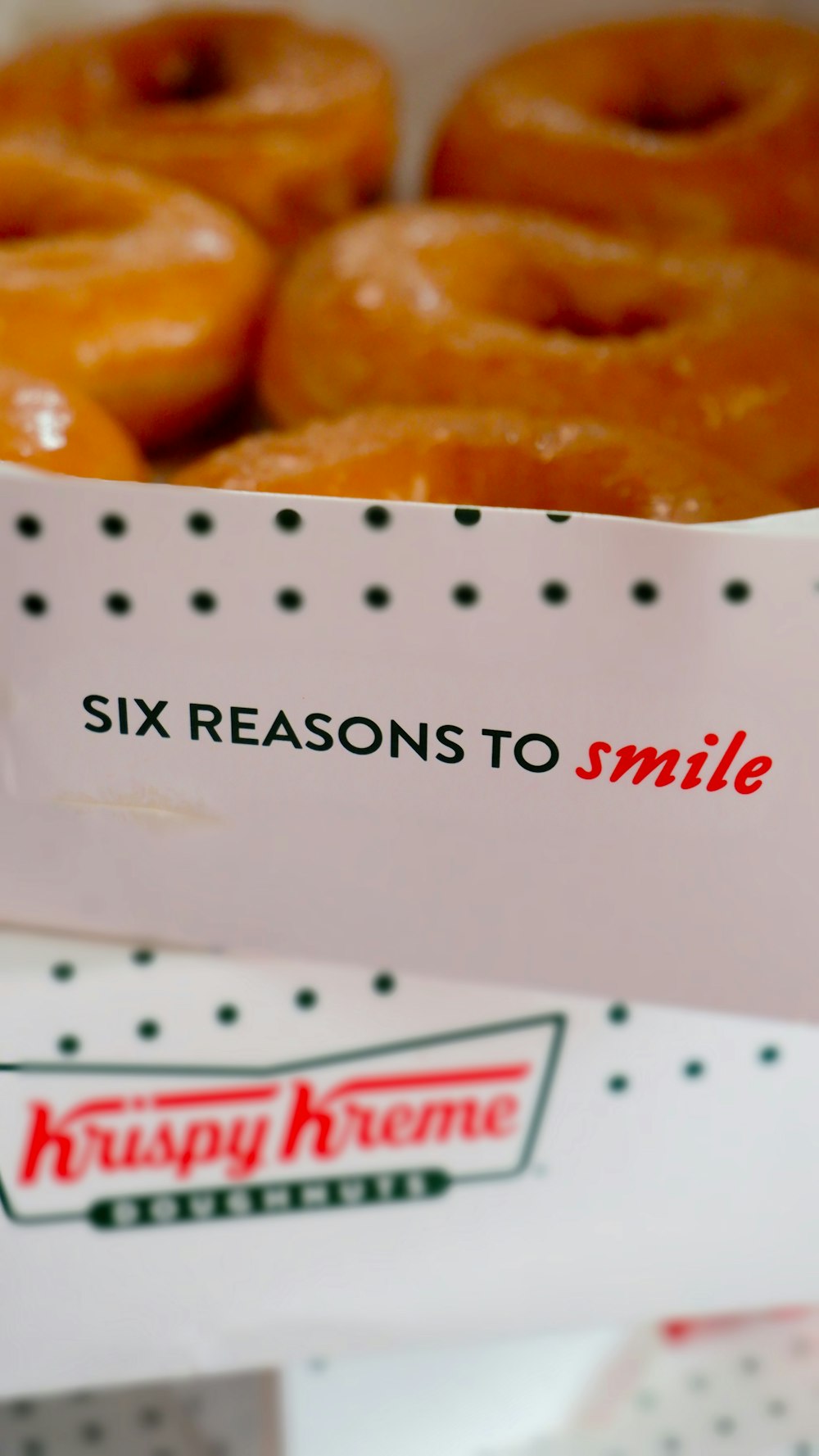 a close up of a box of doughnuts