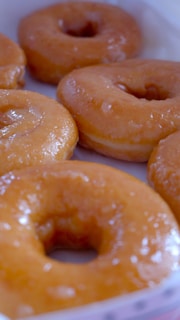 a close up of a box of doughnuts