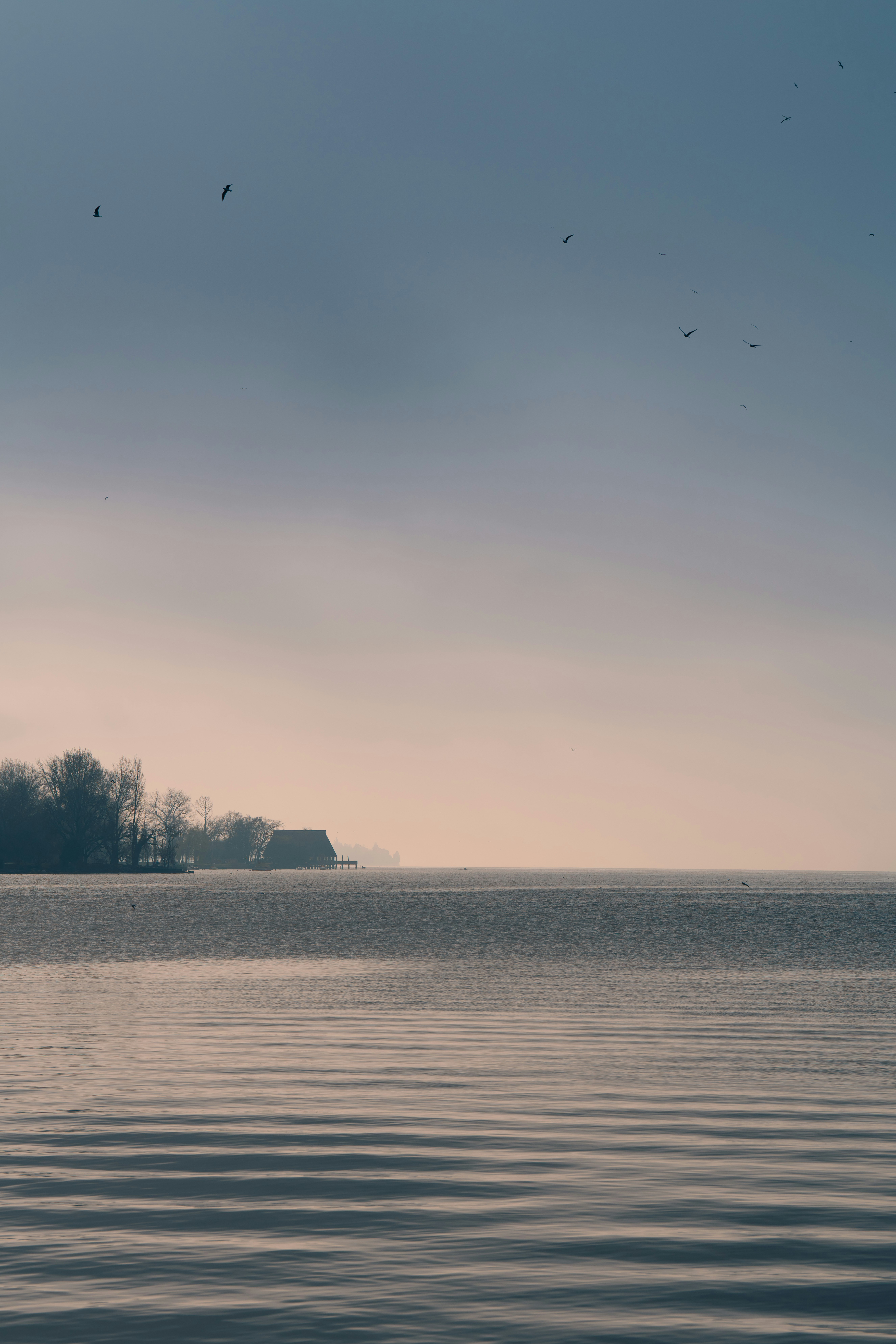 a large body of water with a small island in the distance