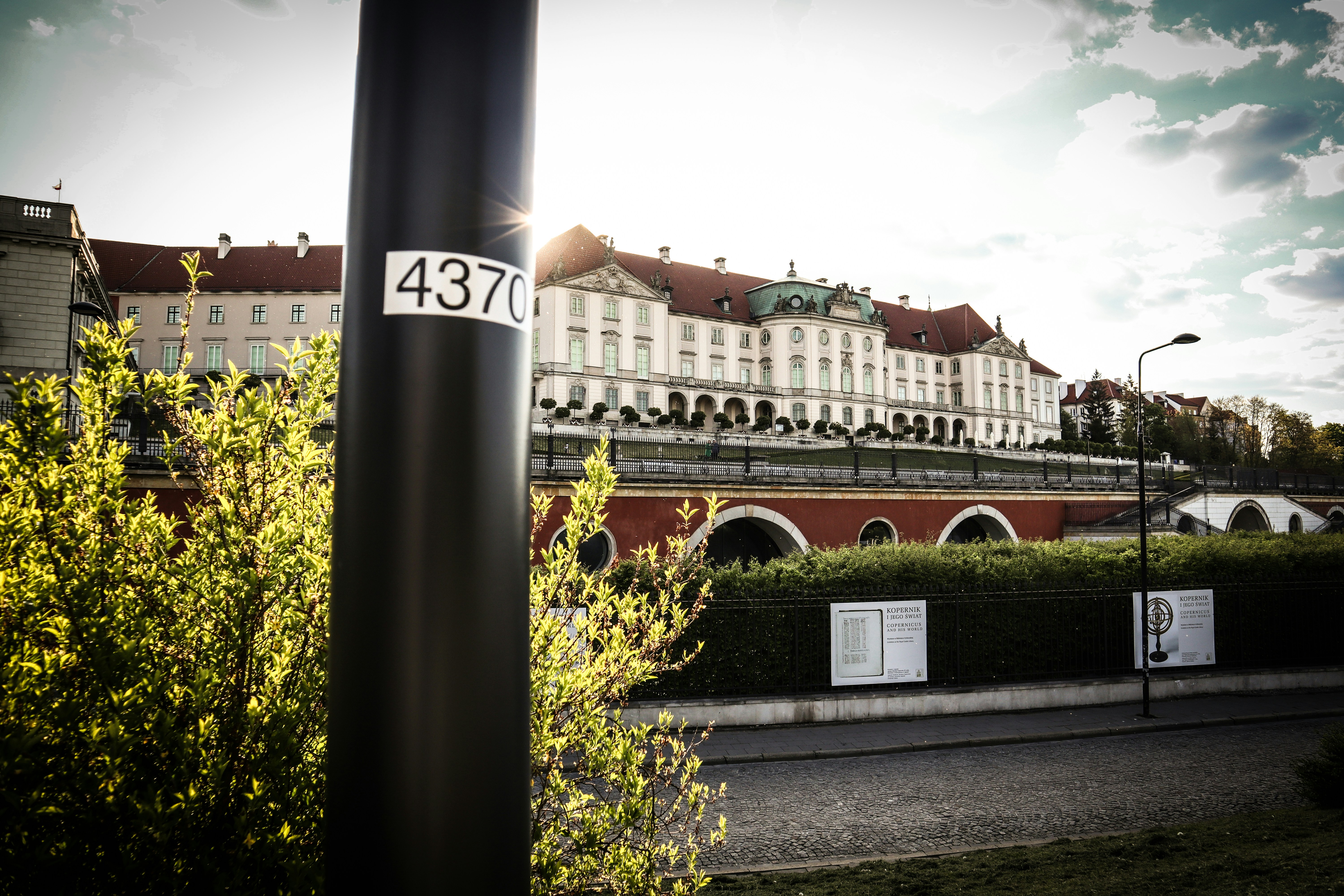 a street sign in front of a large building, 