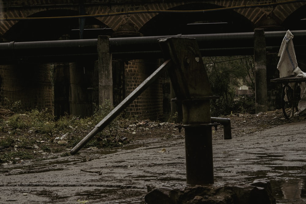 a broken umbrella sitting on the side of a road