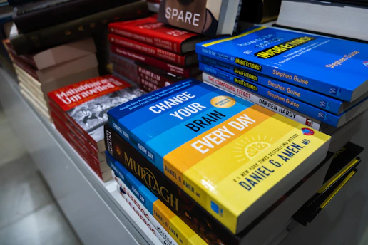a bunch of books that are on a shelf