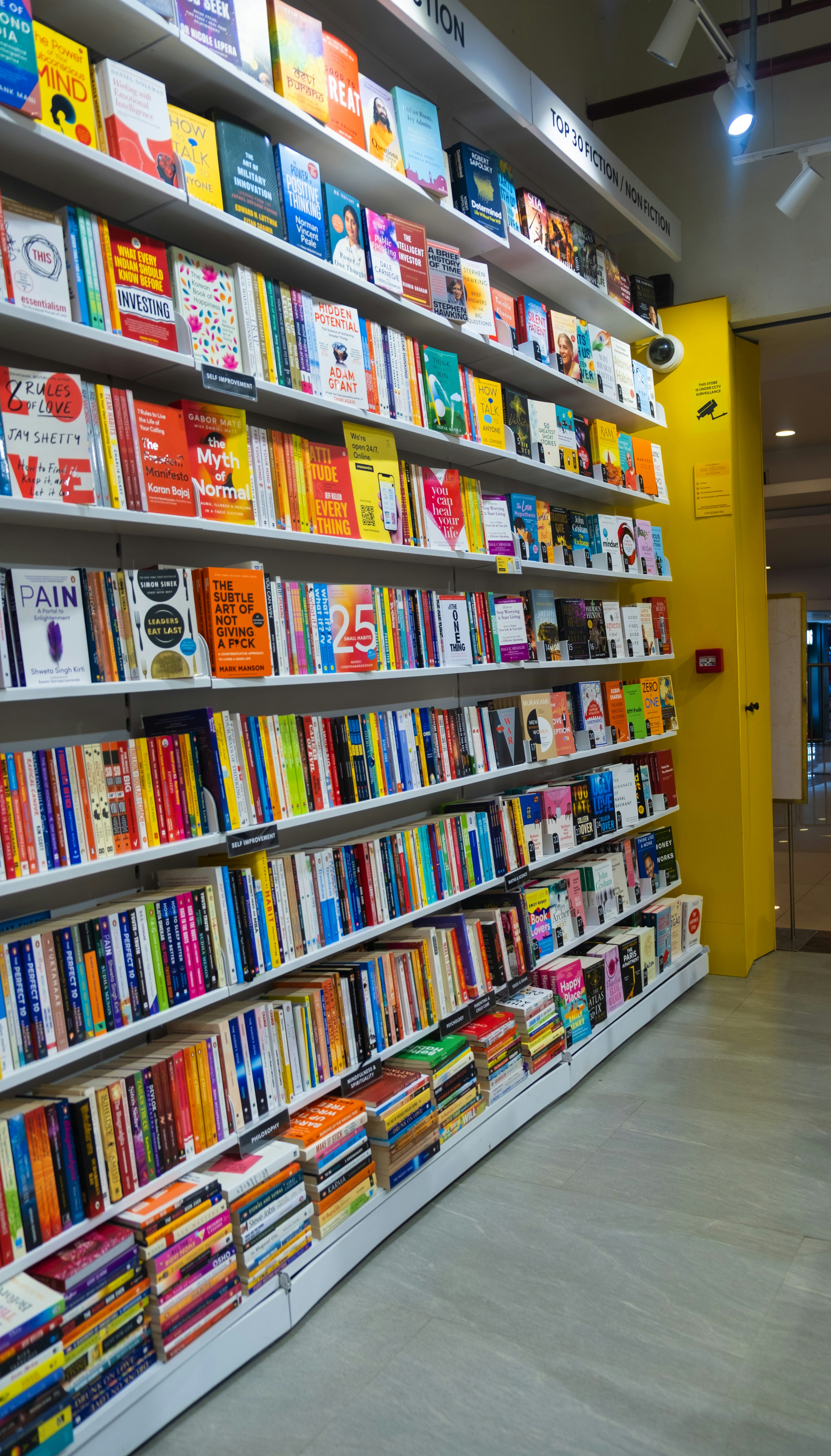 a bookshelf filled with lots of colorful books