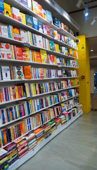 a bookshelf filled with lots of colorful books