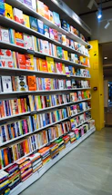 a bookshelf filled with lots of colorful books