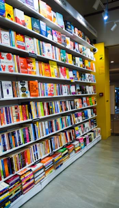 a bookshelf filled with lots of colorful books