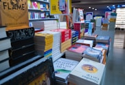 a store filled with lots of books on top of shelves