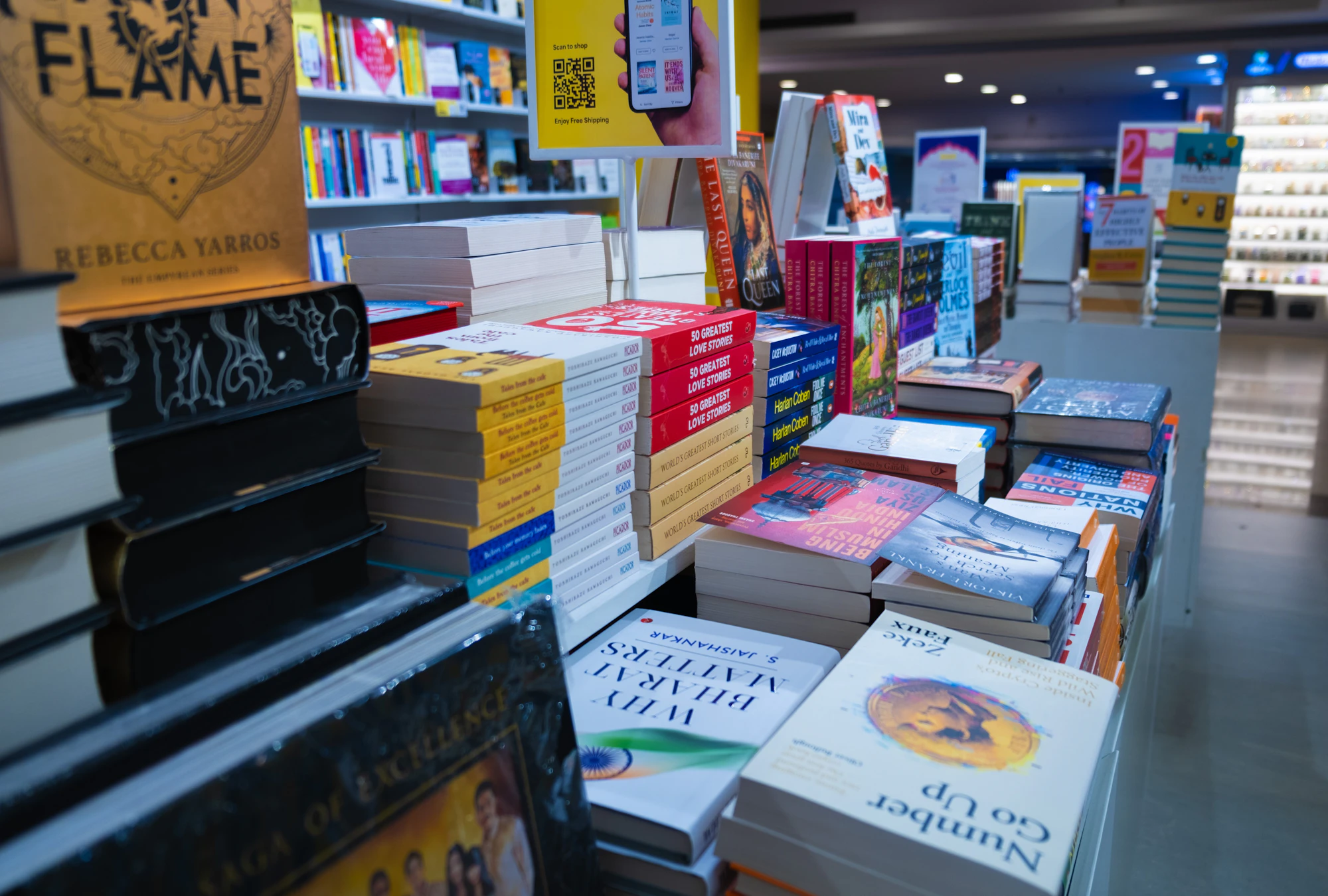 Tables piled with books in a bookshop