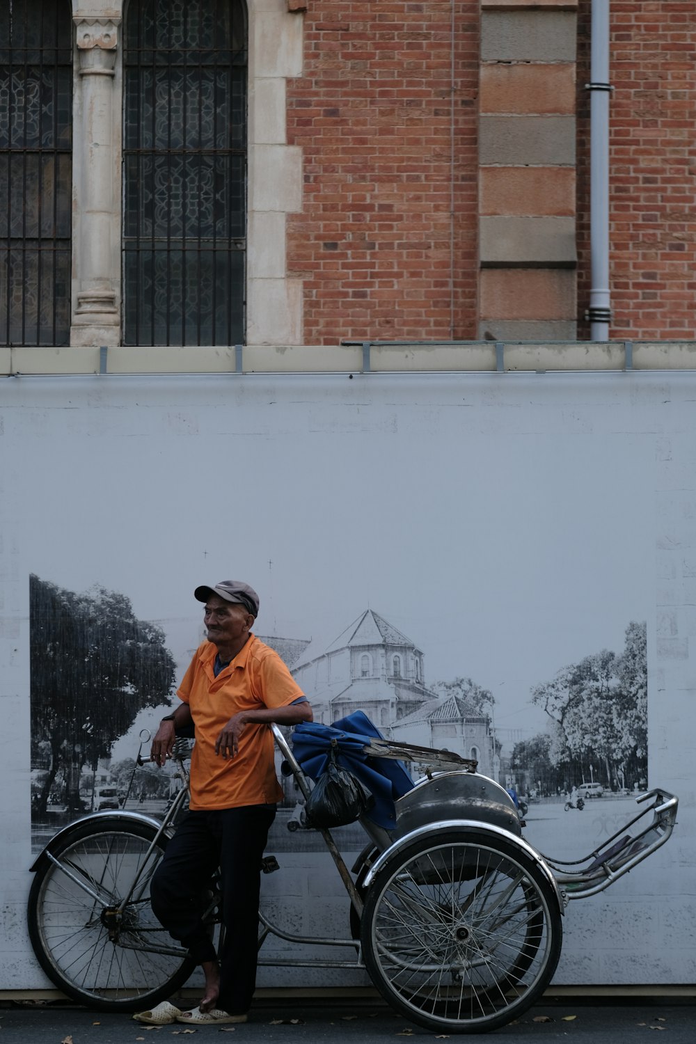 a man standing next to a parked motorcycle