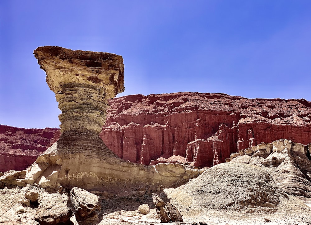 a large rock formation in the middle of a desert