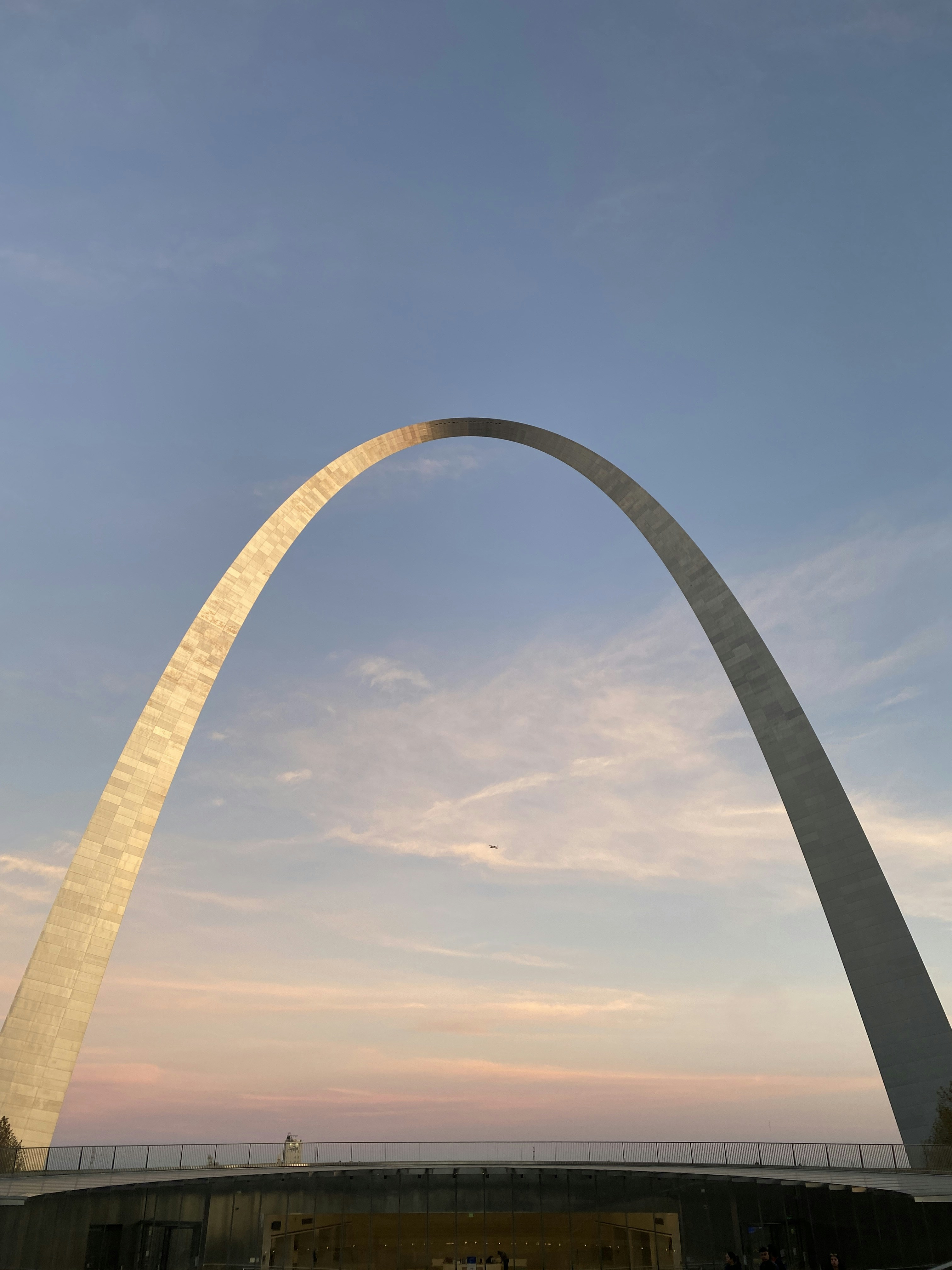 a very tall arch with a sky in the background