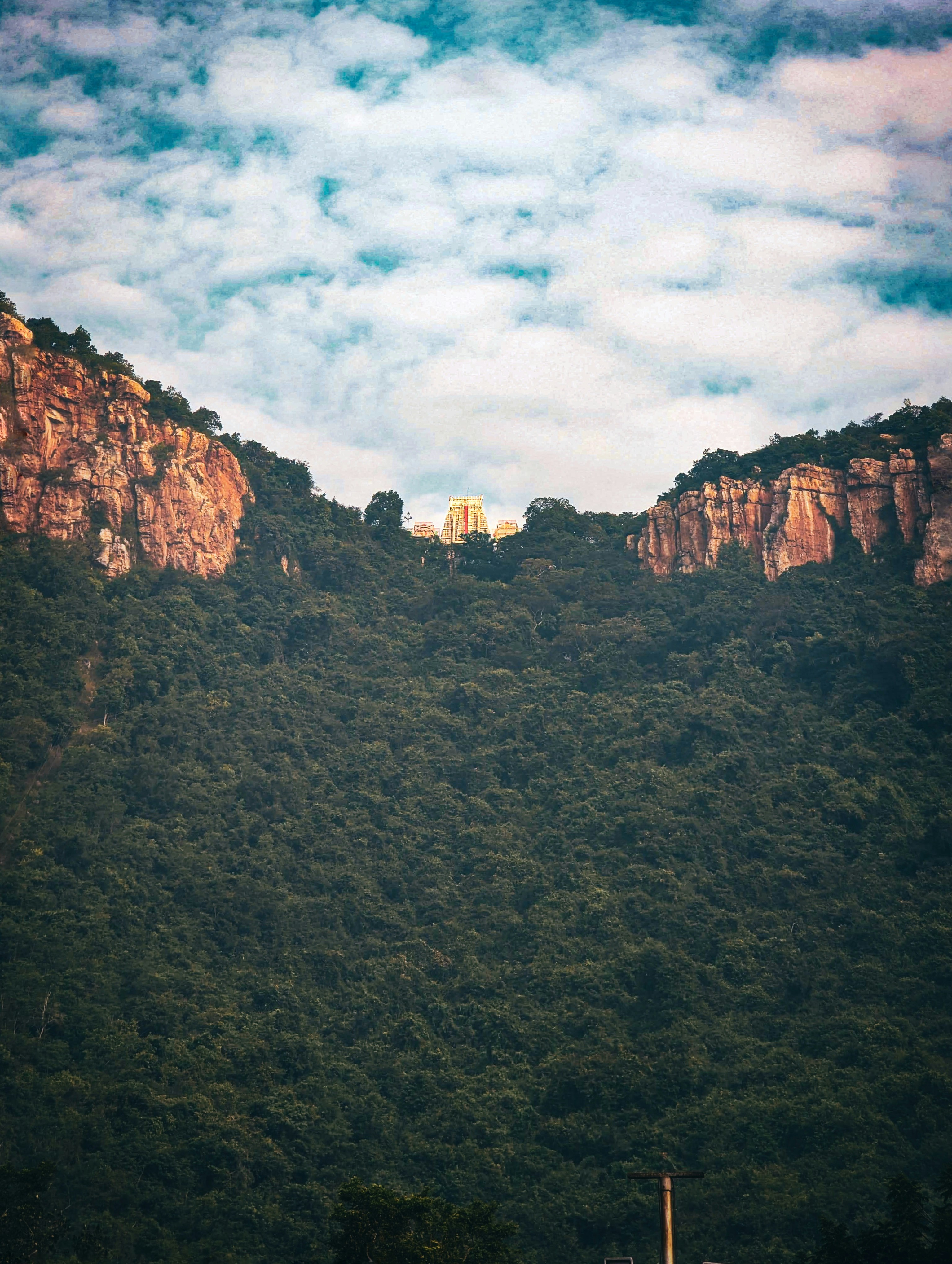 a mountain with a building on top of it