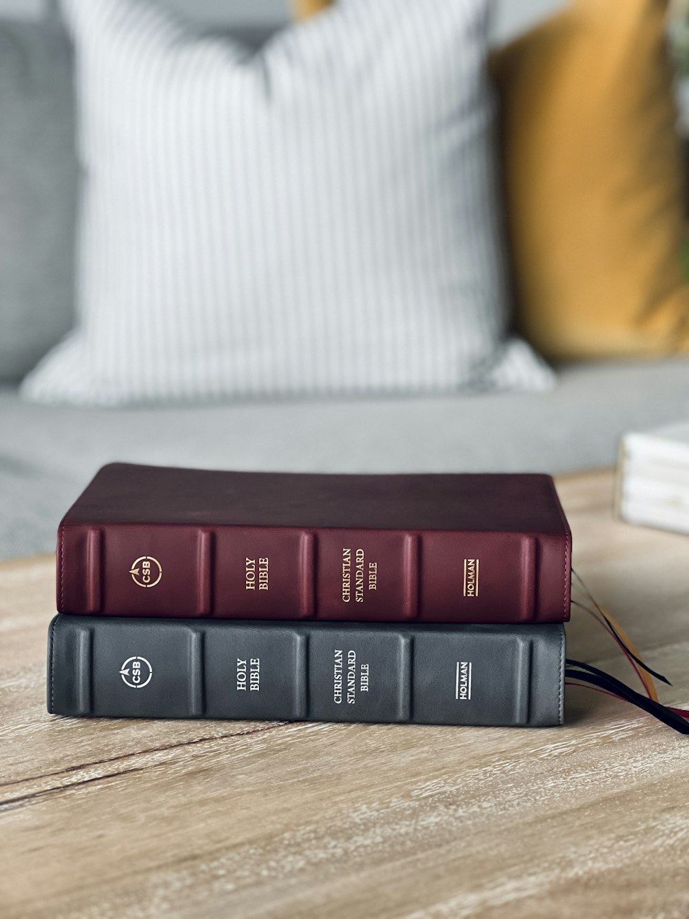 a couple of books sitting on top of a wooden table