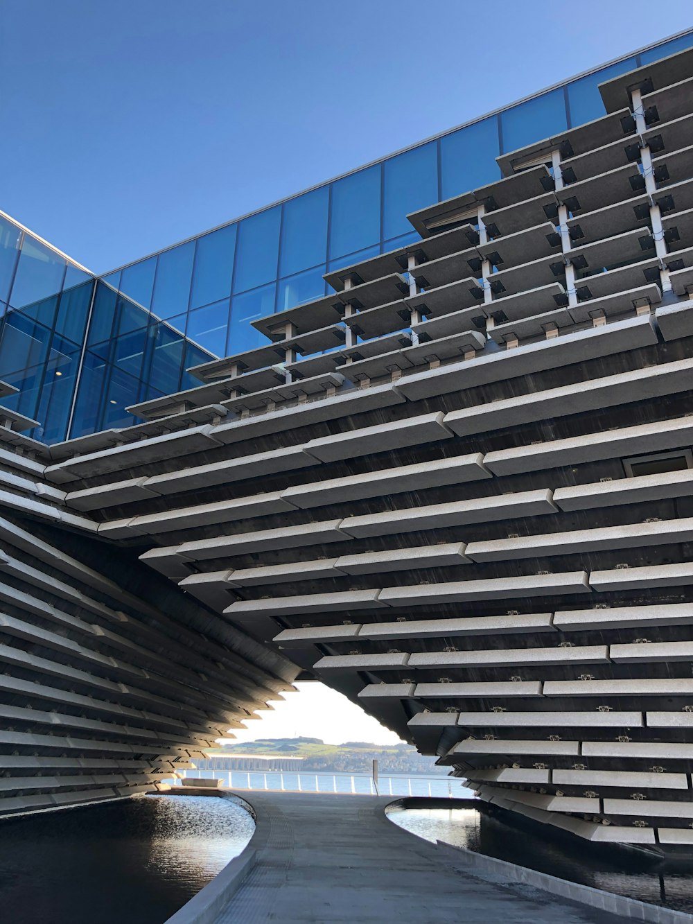 a very large building with a very long walkway