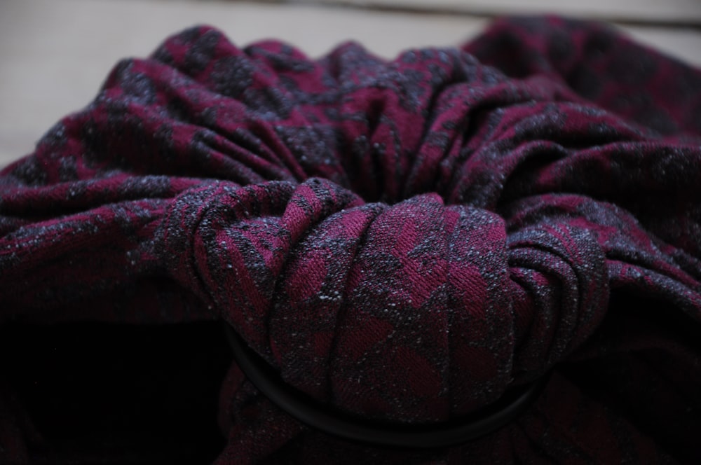 a close up of a purple and black cloth