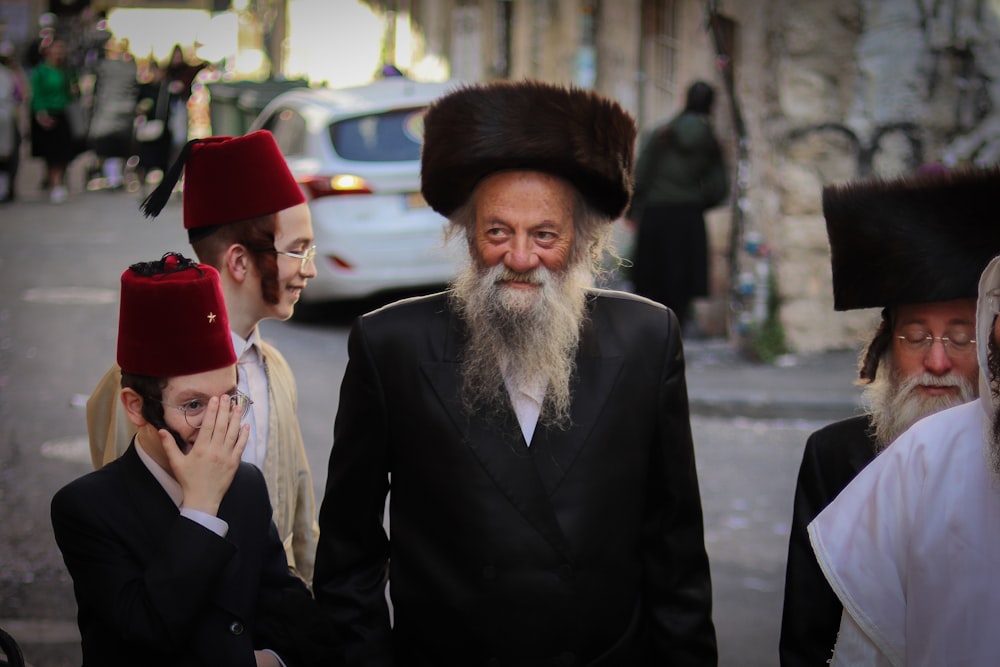 a man with a long beard wearing a red hat