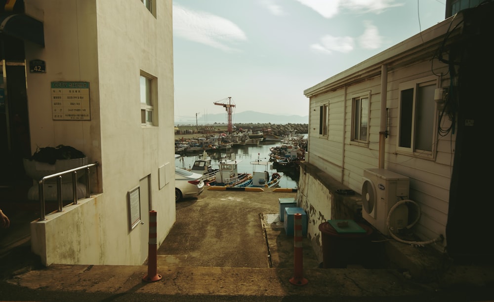 a view of a harbor from an alley way