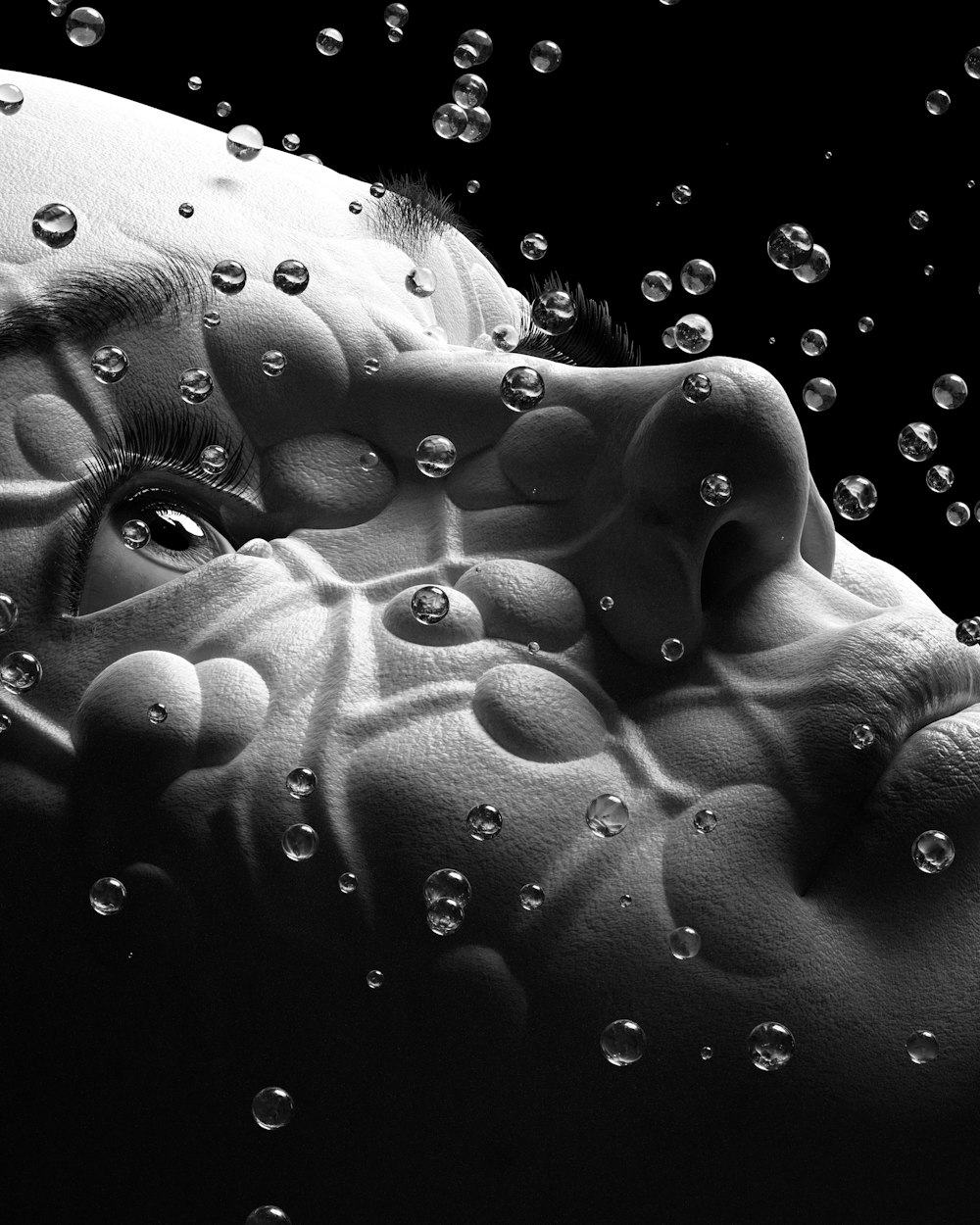 a black and white photo of water bubbles