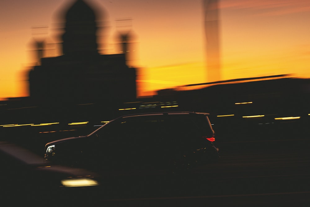 a blurry picture of a city skyline with a clock tower in the background