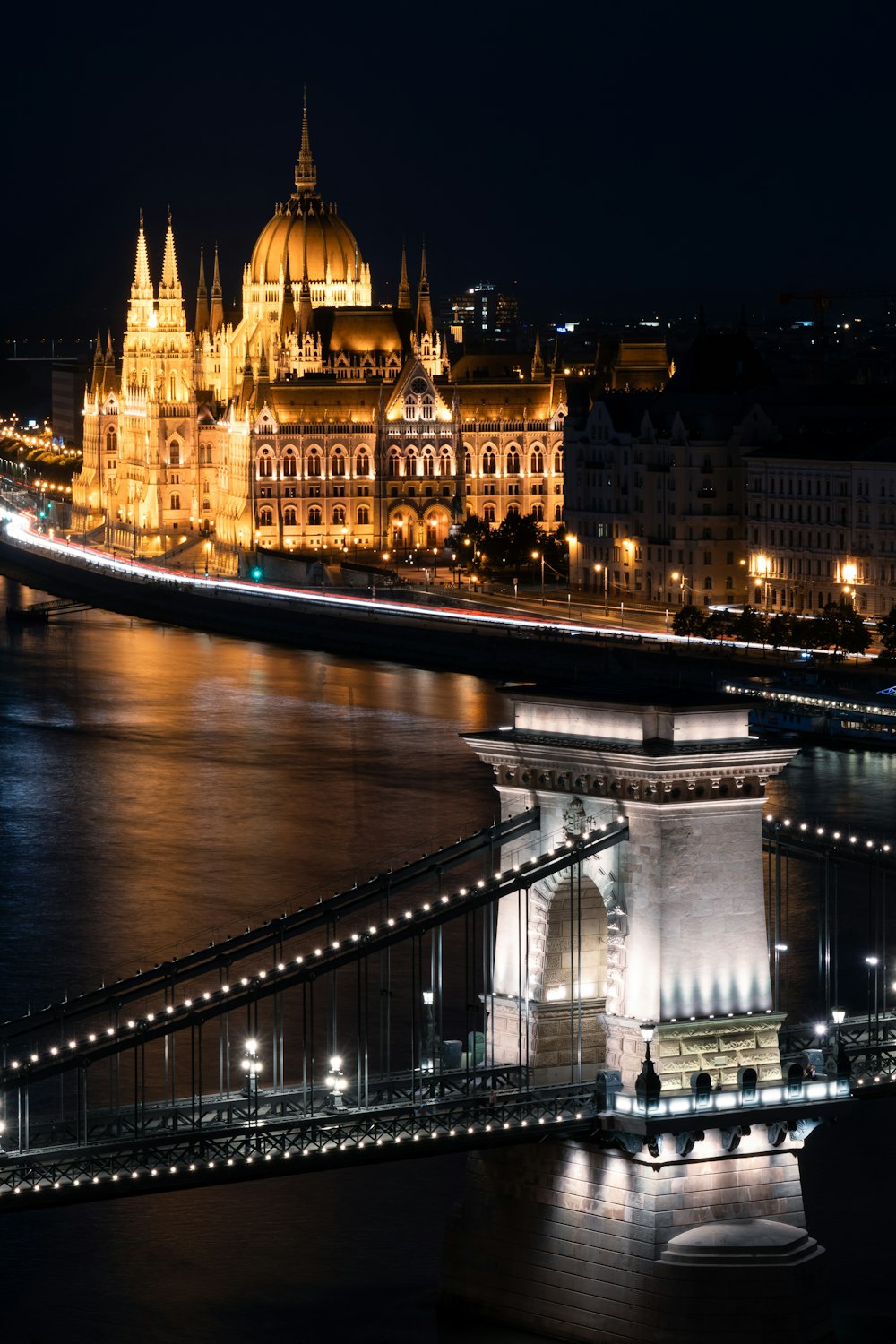 a night view of a city with a bridge